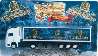 Wolfshöher Millennium Truck 1999/2000, mit 3 Logos vor blauer Landschaft